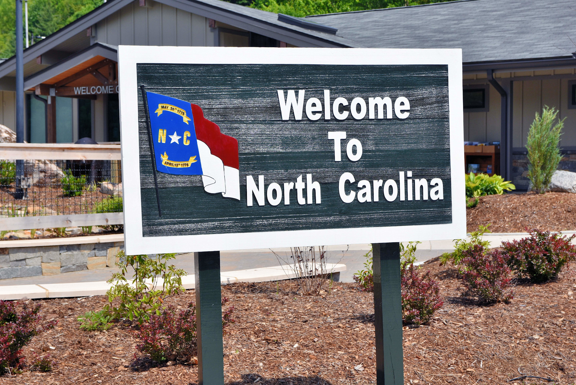 Charlotte,&nbsp;North Carolina's real estate is booming-- and investors still have a chance to enter the market. Charlotte offers many excellent amenities, and is centrally situated in North Carolina. This sign in Clyde, N.C. taken inJune 2020 welcomes those e
