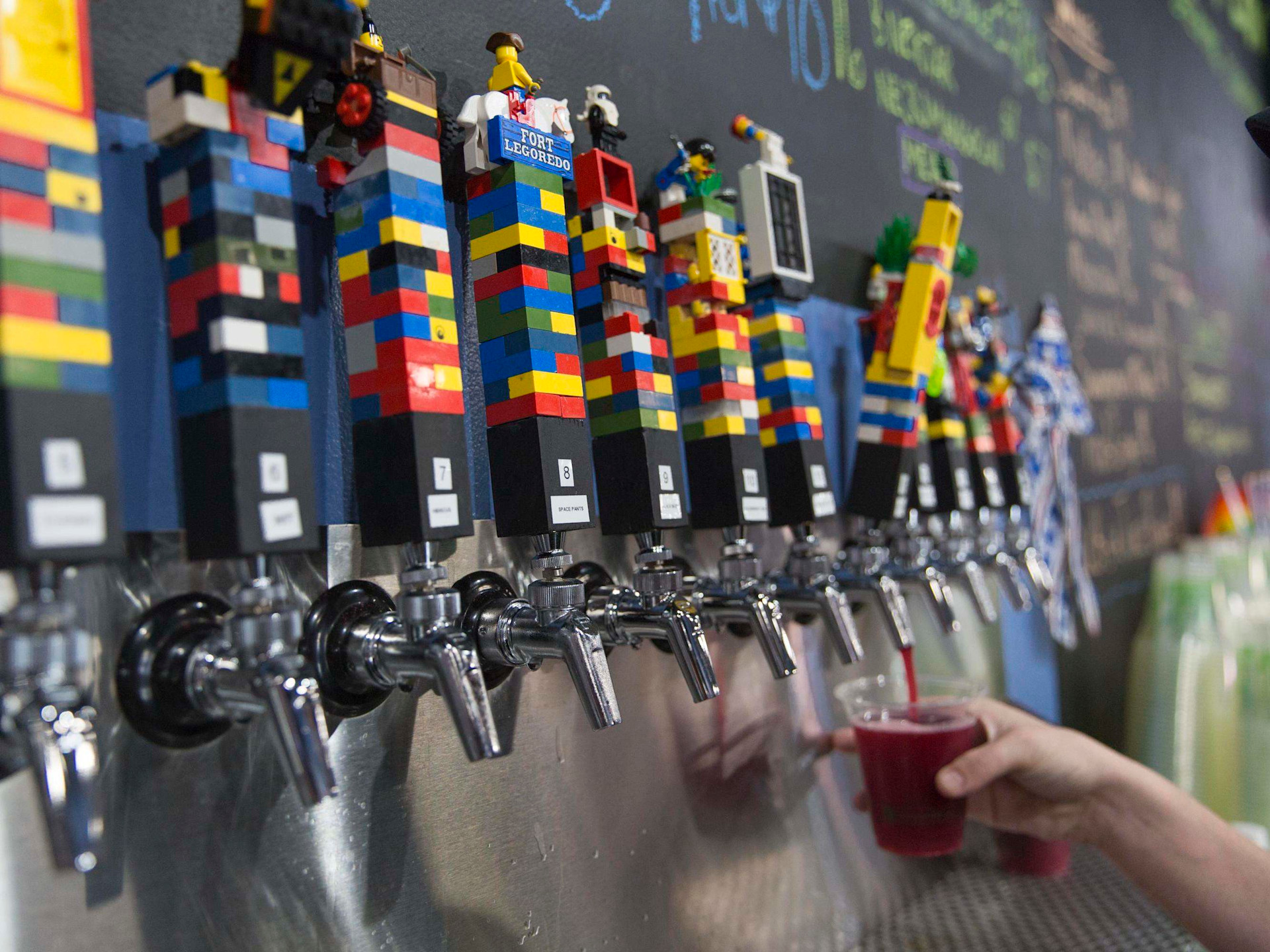 The Overflowing Brewery and its Lego taps are a popular neighborhood spot in Palmetto Park. (Credit: VisitStPeteClearwater.com)&nbsp;