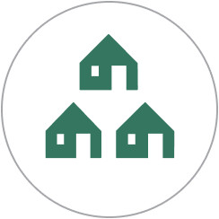 Circle around three green houses that form a triangle shape